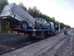 Фото эвакуации легкового авто с прицепом